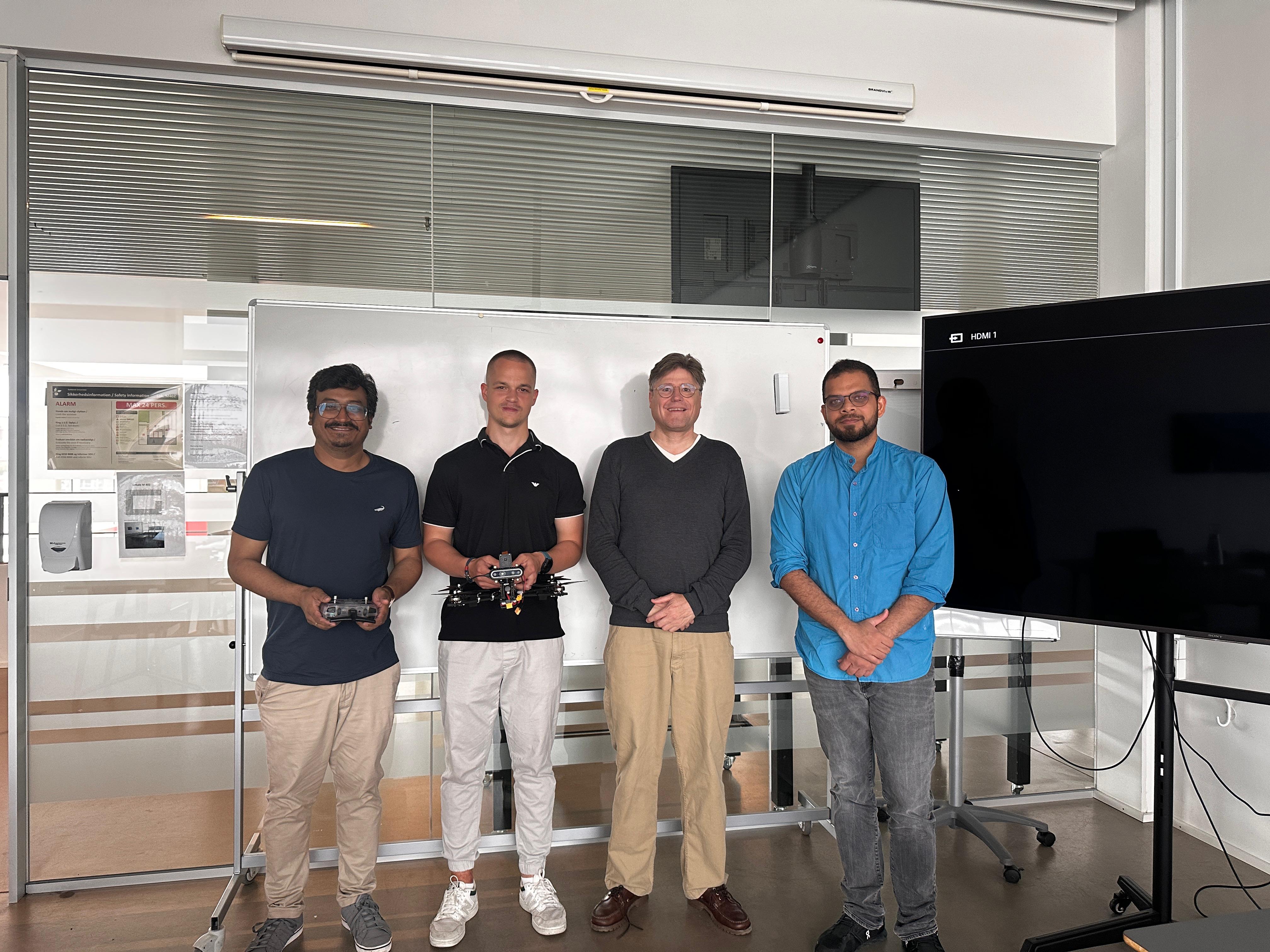 Master's thesis defense with supervisors and a drone platform